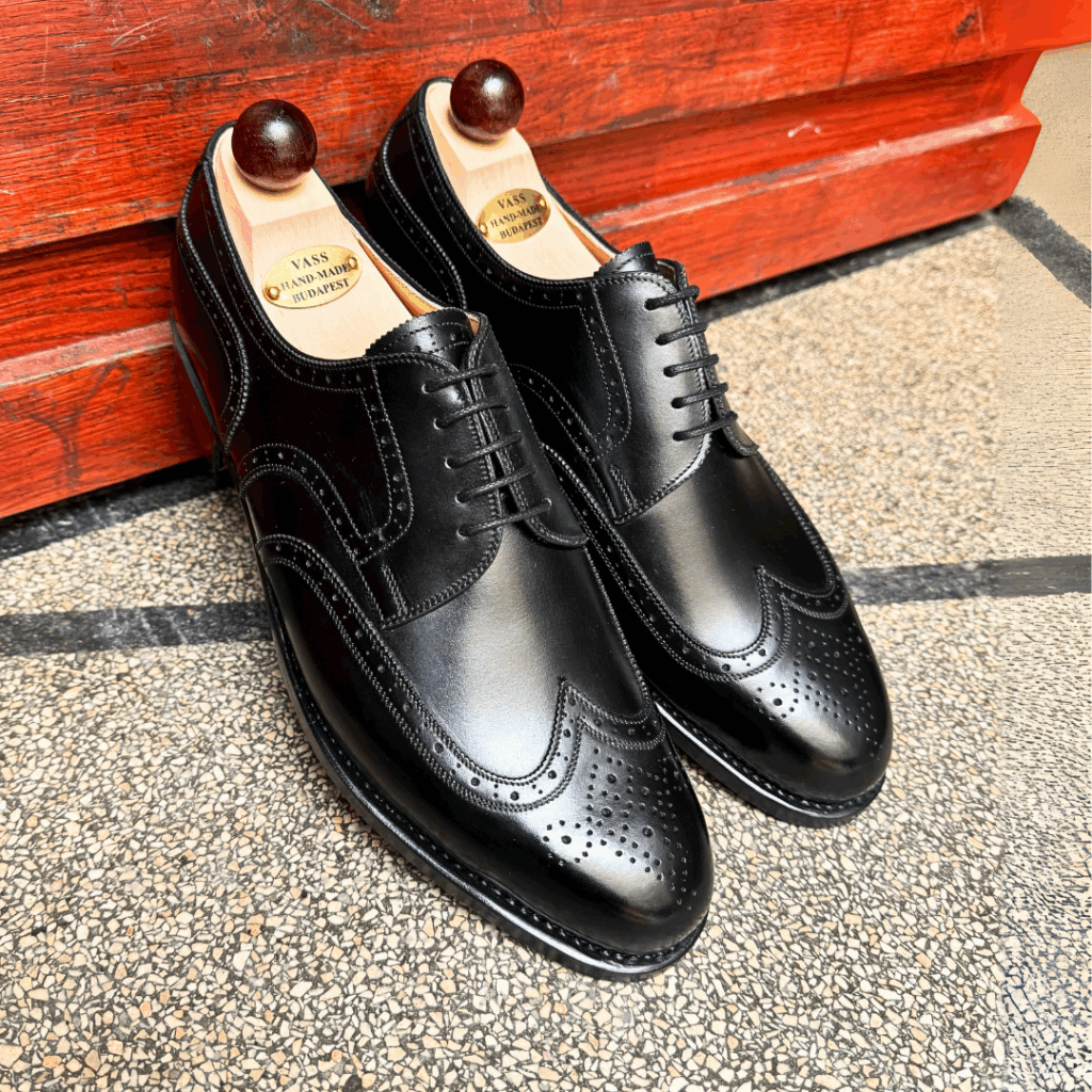 Angle view-1 of men’s black calf Budapest Derby shoe on P2 last with a single leather sole – handmade by Vass Shoes.