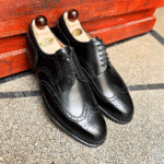Angle view-1 of men’s black calf Budapest Derby shoe on P2 last with a single leather sole – handmade by Vass Shoes.