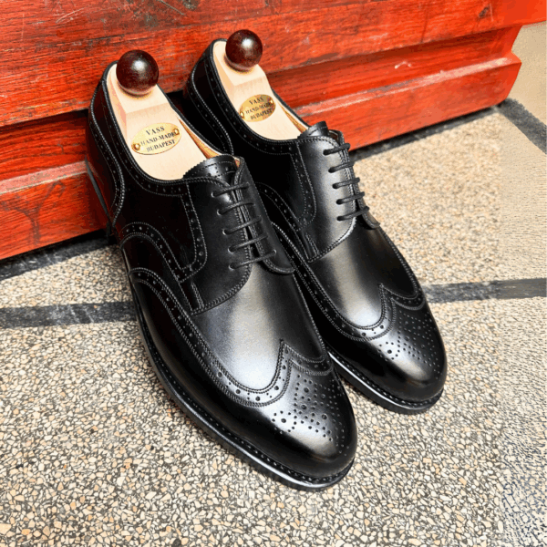 Angle view-1 of men’s black calf Budapest Derby shoe on P2 last with a single leather sole – handmade by Vass Shoes.