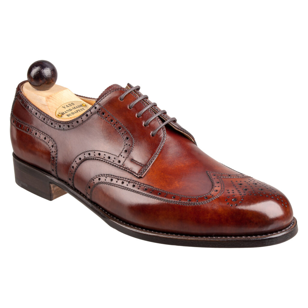 Angle view of men’s gold museum calf Budapest Derby shoe on P2 last with a single leather sole – handmade by Vass Shoes.