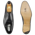 Top view of men’s black calf leather cap toe Oxford shoe on F last with a single sole – handmade by Vass Shoes.