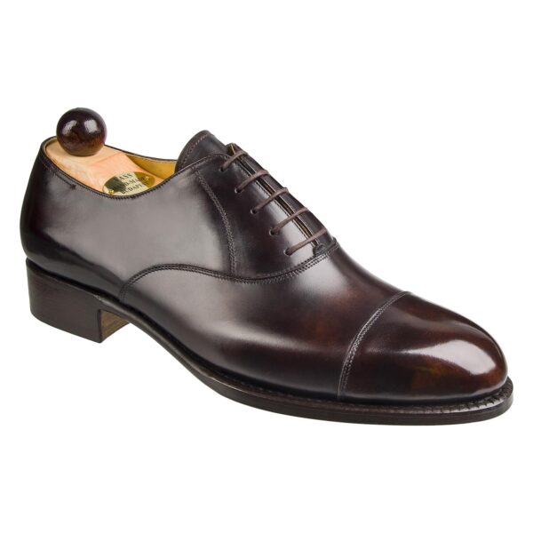 Angle view of men’s brown museum calf leather cap toe Oxford shoe on F last with a single sole – handmade by Vass Shoes.