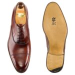 Top view of men’s gold museum calf leather cap toe Oxford shoe on F last with a single sole – handmade by Vass Shoes.