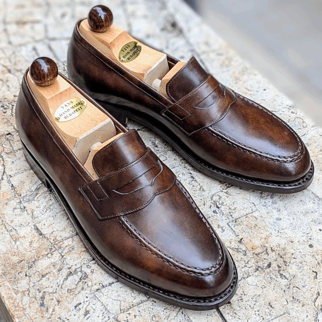 Angle view-1 of men’s walnut museum Slipper II on P last with a single sole – handmade by Vass Shoes.