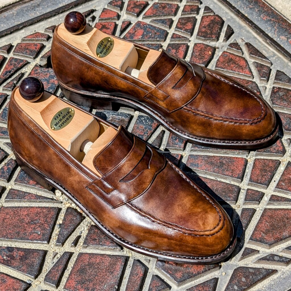 Angle view-3 of men’s walnut museum Slipper II on P last with a single sole – handmade by Vass Shoes.