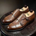 Angle view-2 of men’s antique cognac Double Monk on F last with a single leather sole – handmade by Vass Shoes.