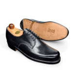 Angle view of men’s black derby London 5-eyelets shoe on BP last with a double sole – handmade by Vass Shoes.