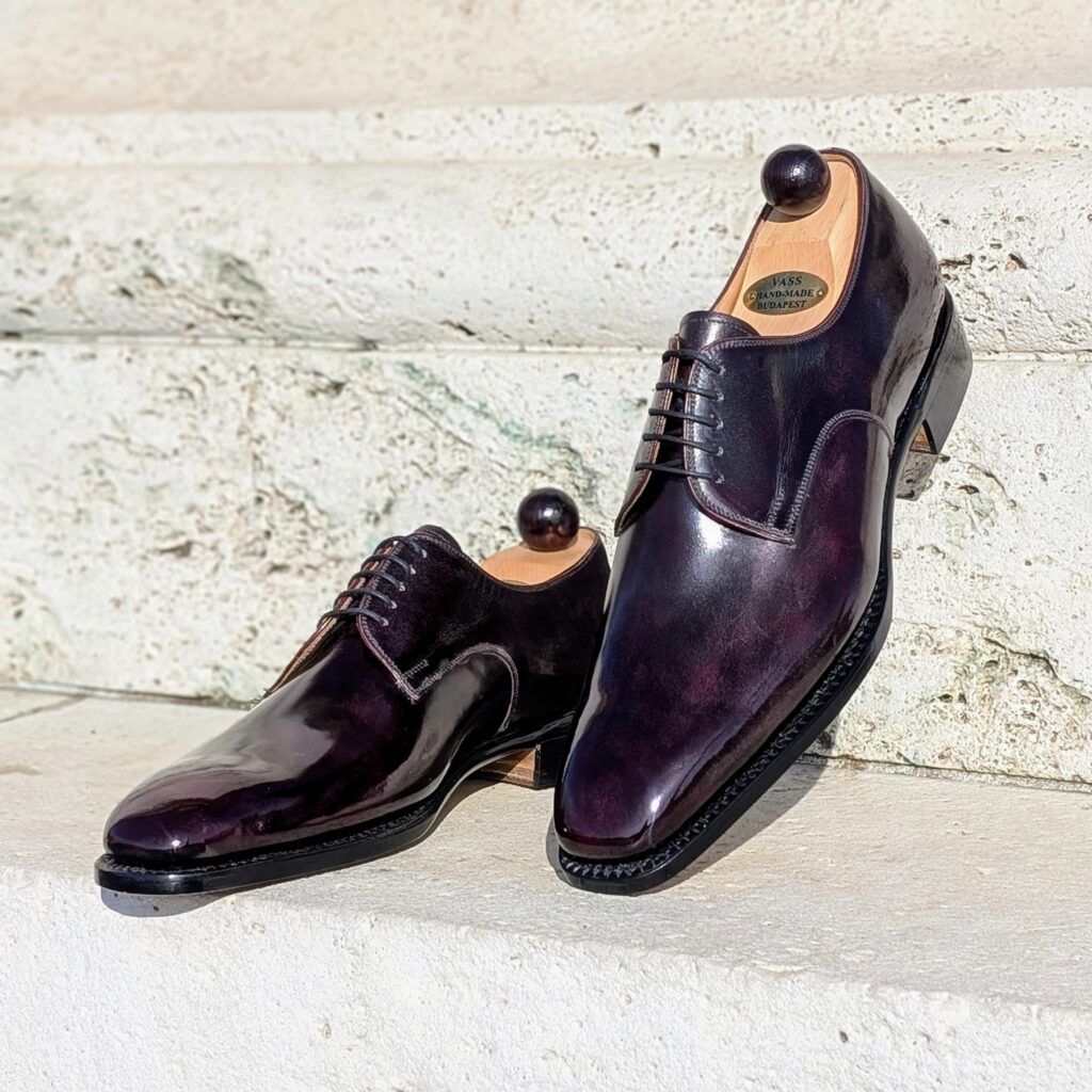 Angle view-1 of men’s bordeaux London 5-eyelets shoe on S last with a single sole – handmade by Vass Shoes.