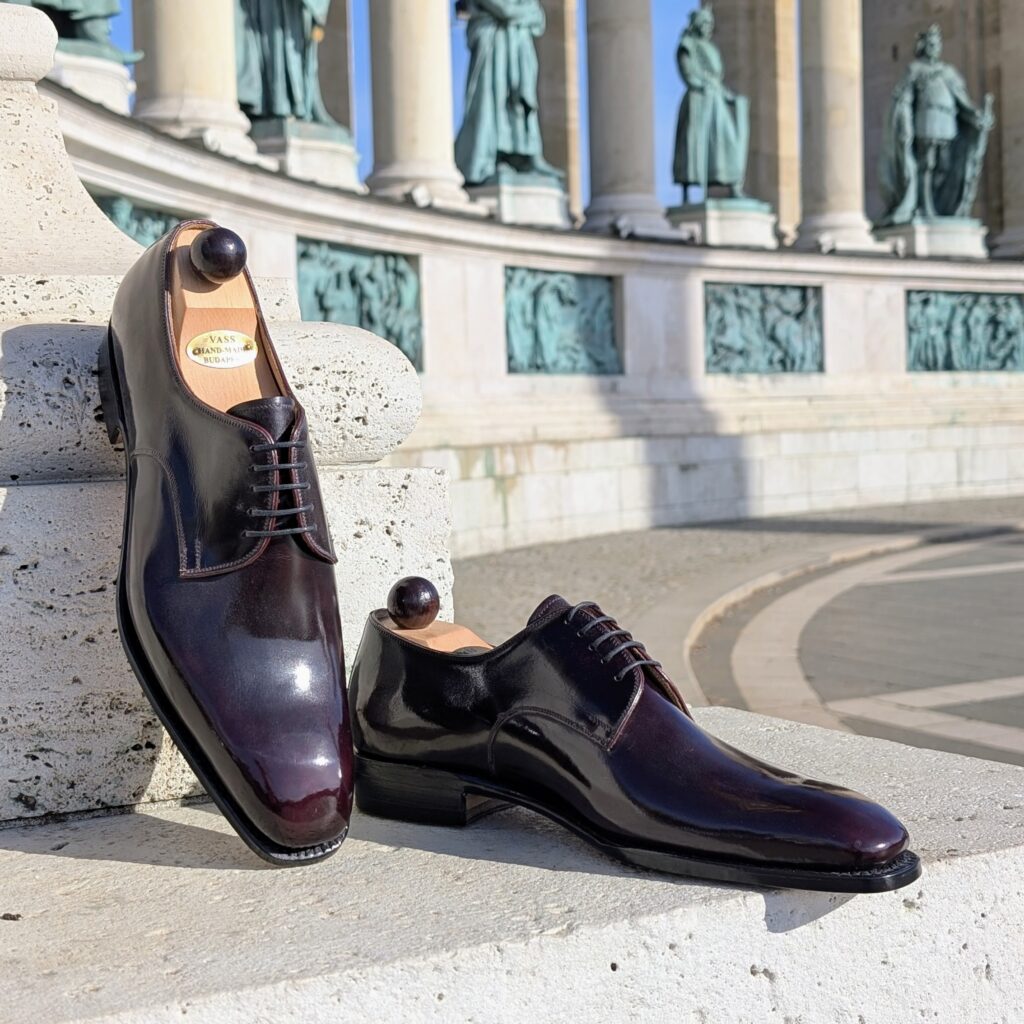 Angle view-2 of men’s bordeaux London 5-eyelets shoe on S last with a single sole – handmade by Vass Shoes.