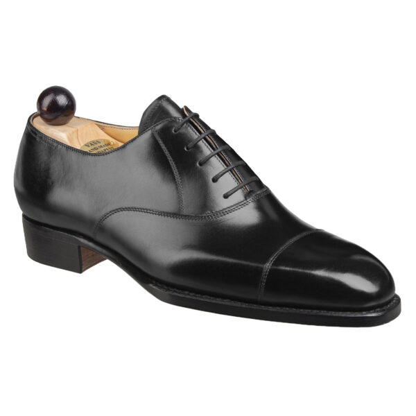 Angle view of men’s black calf leather cap toe Oxford shoe on U last with a single sole – handmade by Vass Shoes.