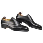 Side view-2 of men’s black calf leather cap toe Oxford shoe on U last with a single sole – handmade by Vass Shoes.