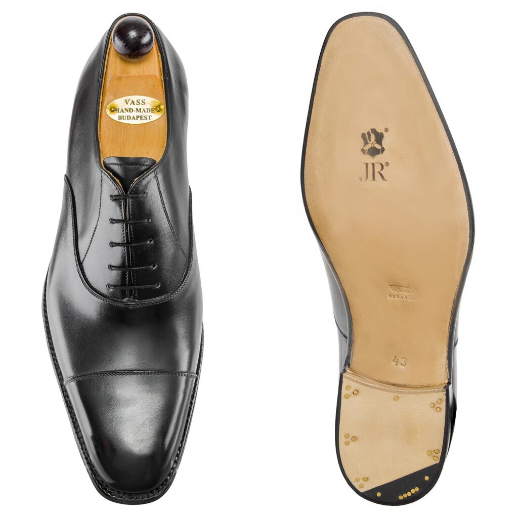 Top view of men’s black calf leather cap toe Oxford shoe on U last with a single sole – handmade by Vass Shoes.