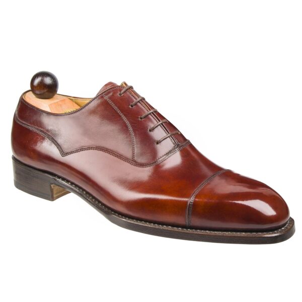 Angle view-1 of men’s gold museum calf Alt English II plain Oxford shoe on K last with a single sole – handmade by Vass Shoes.