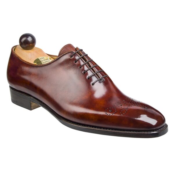 Angle view of men’s gold Wholecut 6-eyelets on S last with a single sole – handmade by Vass Shoes.