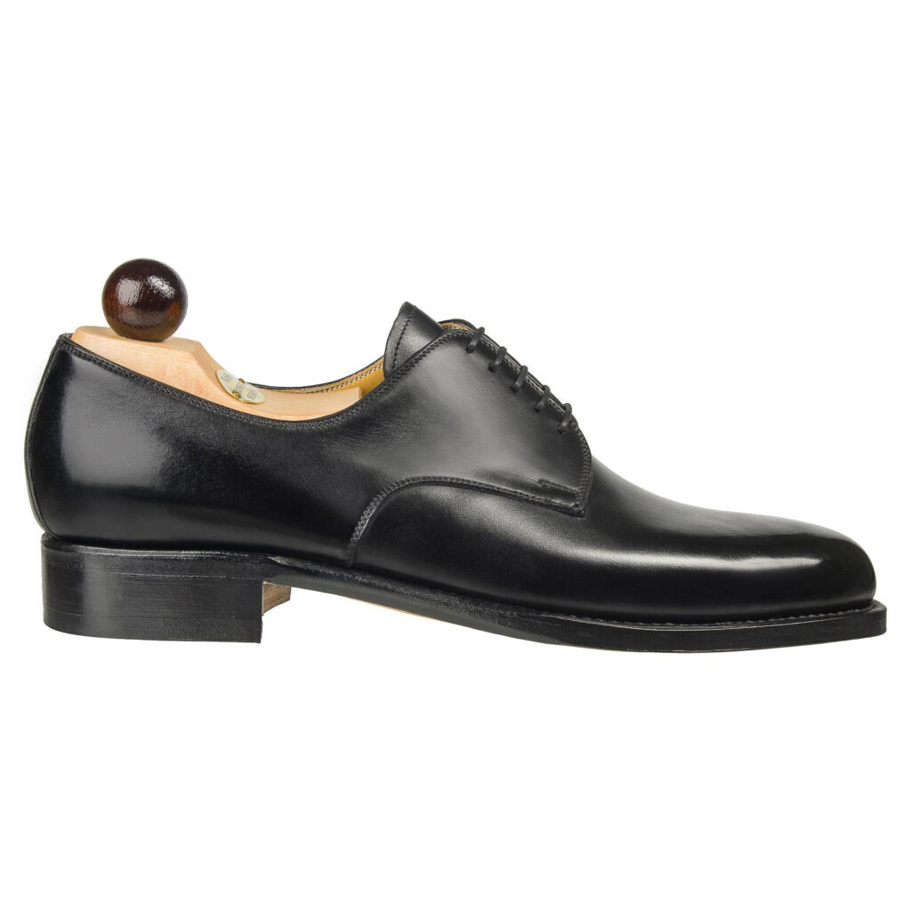 Side view-1 of men’s black London 5-eyelets shoe on P2 last with a single sole – handmade by Vass Shoes.