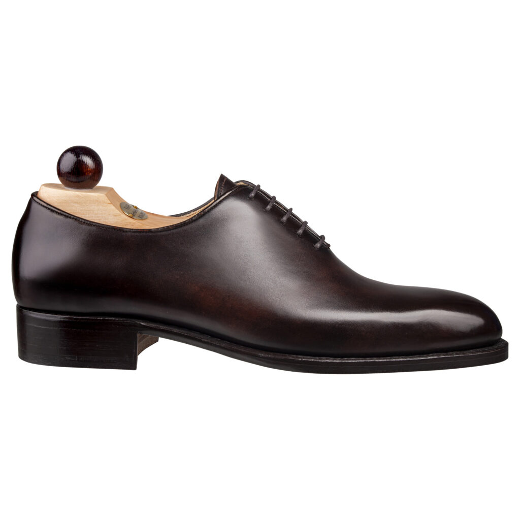 Side view-1 of men’s brown Wholecut 5-eyelets on F last with a single sole – handmade by Vass Shoes.