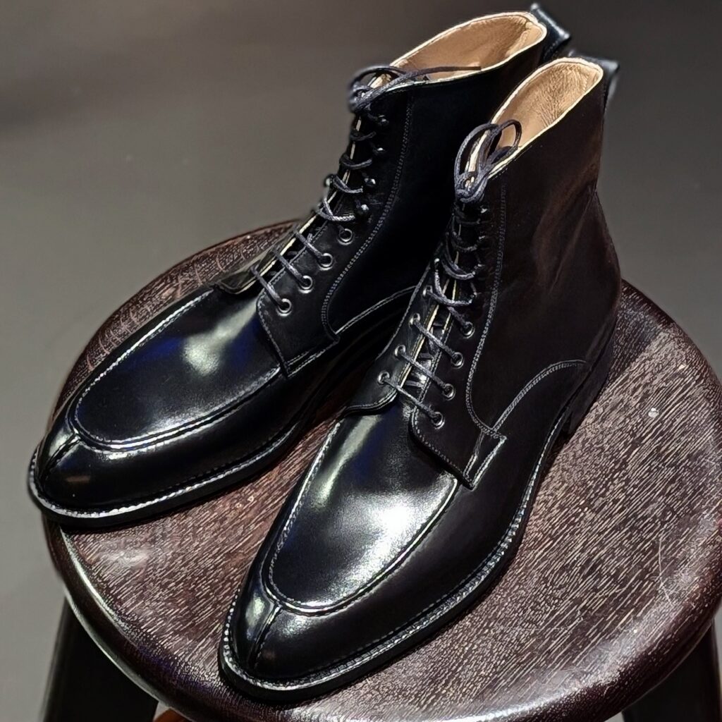 Top view of men’s black calf Oslo high boots on F last with a dainite sole – handmade by Vass Shoes.