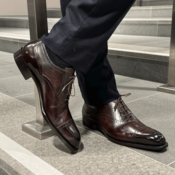 Angle view-2 of men’s brown museum Alt English II brogue Oxford shoe on K last with single sole – handmade by Vass Shoes.
