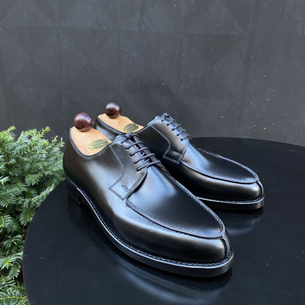 Angle view of men’s black calf Norweger shoe on P last with a double sole – handmade by Vass Shoes.