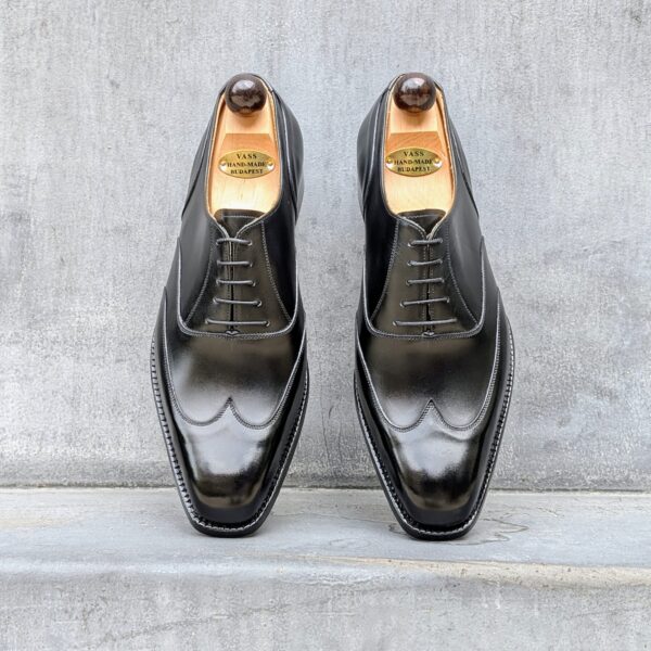 Top view-2 of men’s black calf leather wingtip Oxford shoe on U last with a single sole – handmade by Vass Shoes.
