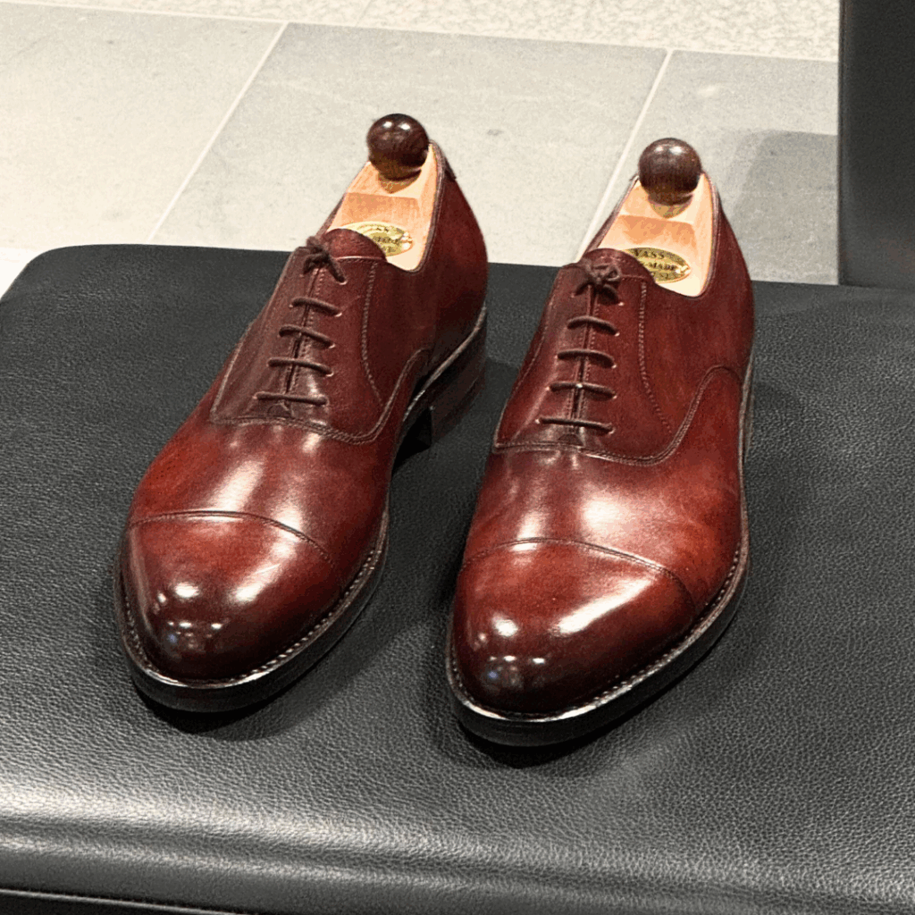 Top view of men’s gold museum calf cap toe Oxford shoe on P2 last with a single sole – handmade by Vass Shoes.