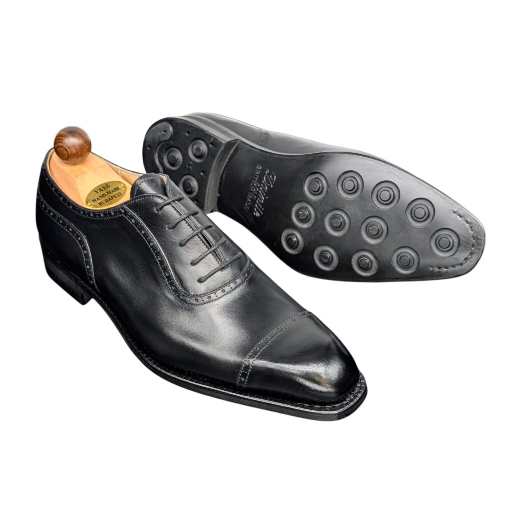 Angle view-2 of men’s black Italian Oxford round-heel-cap shoe on K last with a dainite sole – handmade by Vass Shoes.