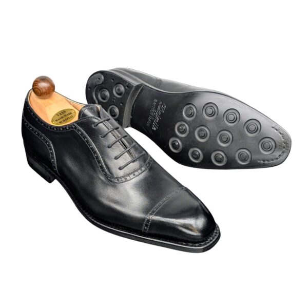 Angle view-2 of men’s black Italian Oxford round-heel-cap shoe on K last with a dainite sole – handmade by Vass Shoes.