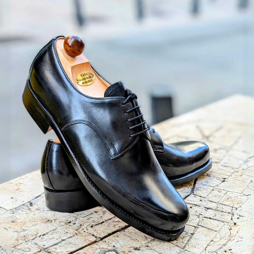 Side view-3 of men’s black derby London 5-eyelets shoe on BP last with a double sole – handmade by Vass Shoes.