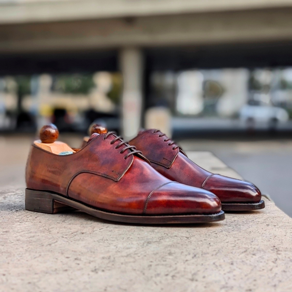 Side view of men’s gold museum Theresianer shoe on P2 last with a single sole – handmade by Vass Shoes.