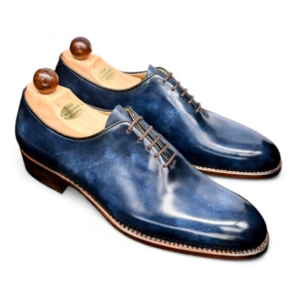 Angle view-1 of men’s blue museum Wholecut 5-eyelets on F last with a single sole – handmade by Vass Shoes.