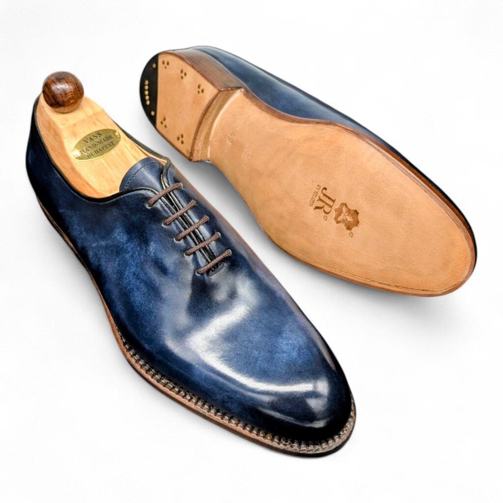 Angle view-2 of men’s blue museum Wholecut 5-eyelets on F last with a single sole – handmade by Vass Shoes.
